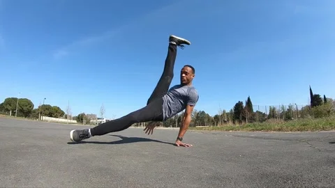 Dancer performing a breakdancing move in slow motion Stock Footage 154111688