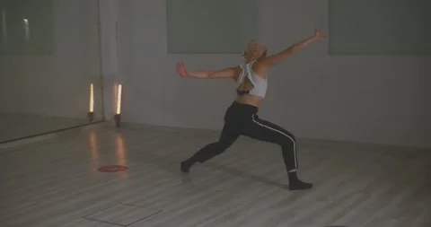 Dancer performing choreography with flow of movement full of emotion Stock Footage 229487885