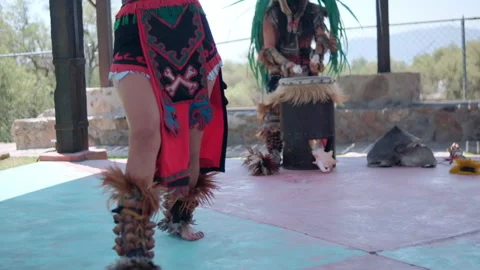 Dancer performing dance of pre-Hispanic culture with bright sky as background Stock Footage 162079600