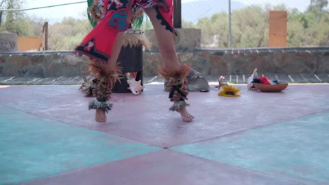 Dancer performing dance of pre-Hispanic culture with bright sky as background Stock Footage 162601838