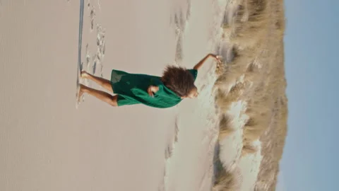 Dancer performing summer desert vertically oriented. Curly girl dance sand beach Stock Footage 268341681