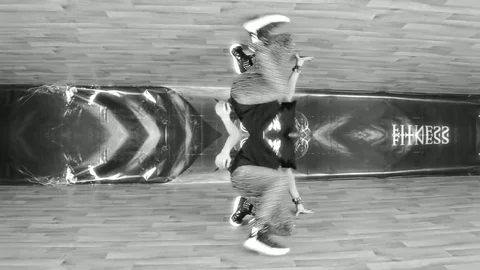 Dancer Performs Acrobatic Dance On Front Of Camera In Black White Stock Footage 85194318