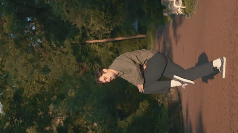 A Dancer Performs Contemporary: Improvisation At Sunset In The Park 4k Video Stock Footage 275347666