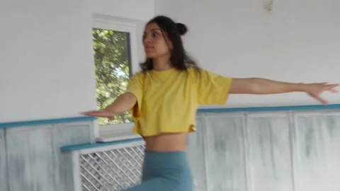 Dancer performs dynamic contemporary dance in a studio with spins fluid gestures Video stock 287099310