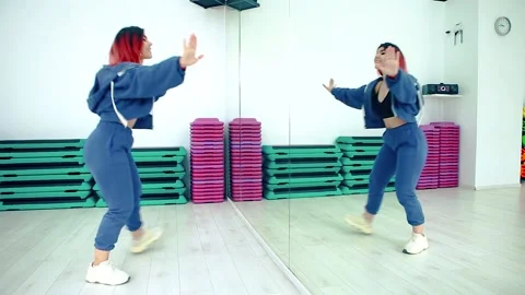 A dancer performs a modern dance in the studio. Stock Footage 150903206