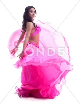 Dancer in pink costume performing oriental dance Stock Photos