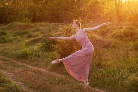 A dancer in pointe dancing in the summer in the sun. postcard and banner Foto stock