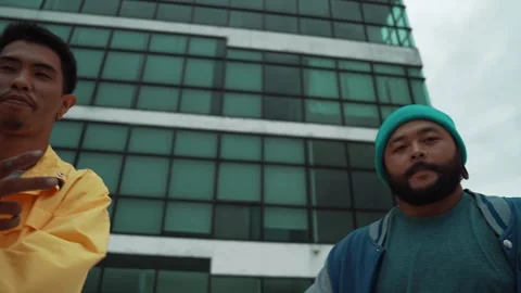 Dancer pose at camera while standing at rooftop. Low angle camera. hiphop. Stock Footage 274123536