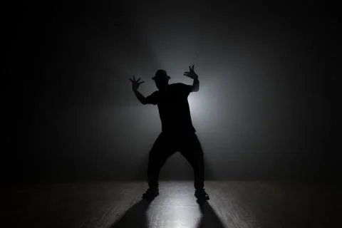 Dancer posing backlit. Stock Photos