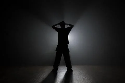 Dancer posing in the dark and smoke Stock-Fotos