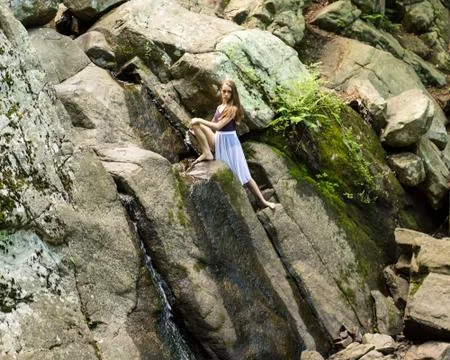 Dancer posing on a waterfall 写真素材