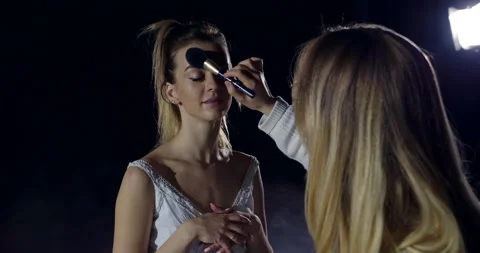 The dancer is put on makeup before the performance Stock Footage 154760507