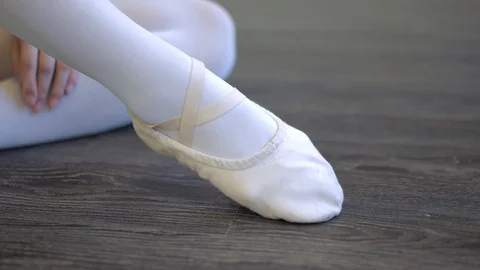 Dancer putting on ballet slipper Stock Footage 121389368