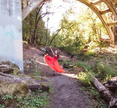 Dancer in red doing a kick Stock Photos