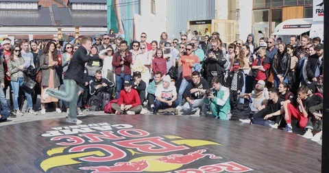 Dancer In Red Pants Dancing Bottom Breakdance Surrounded By A Crowd. Stock-Footage 109991338
