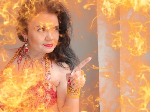 A dancer in a red suit is dancing an oriental dance on a white background. A Stock Footage 266145291