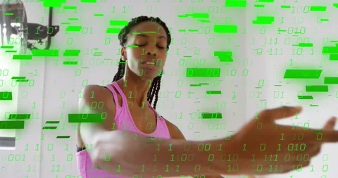 Dancer responding to flickering binary code, extending arms and rotating torso Stock Footage 317834094