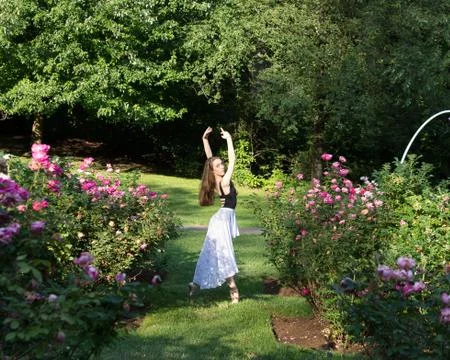 Dancer in a rose garden Stock Photos