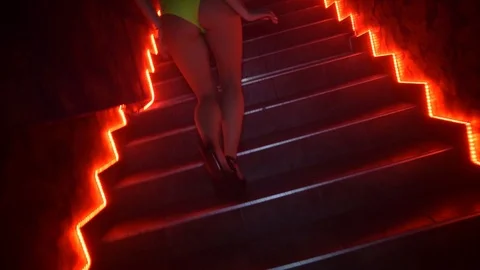 Dancer in sexy lingerie in a nightclub climbs the stairs Stock Footage
