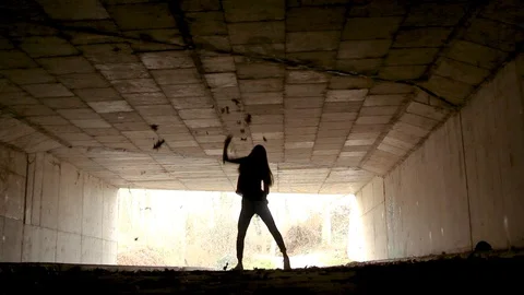 Dancer Silhouette At The End Of A Tunnel Video stock 128388454