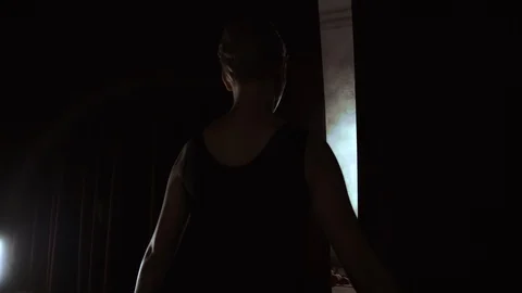 Dancer standing behind a stage curtain waiting onstage and backstage fueled and Stock Footage 113225642