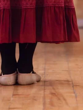 A dancer standing in a dance school room attending a lesson Foto stock
