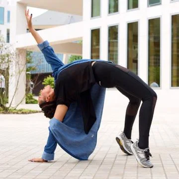 Dancer in the street bending backwards Stock Photos