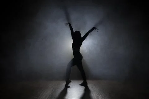 Dancer in the studio, silhouette. Stock Photos
