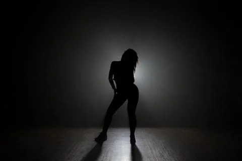 Dancer in the studio, silhouette. Stock Photos