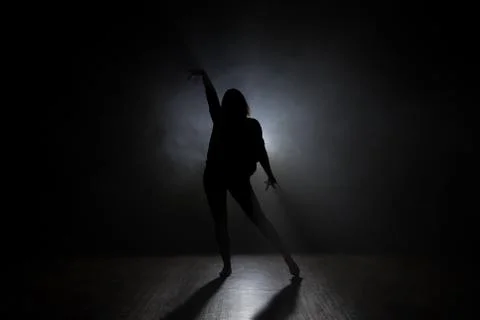Dancer in the studio, silhouette. Stock Photos