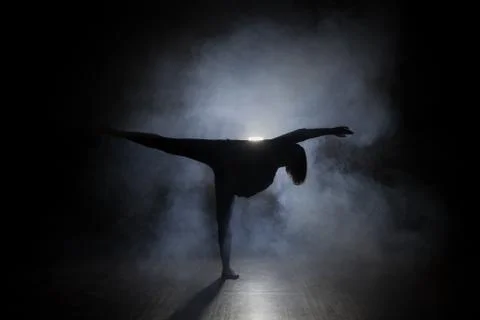 Dancer in the studio, silhouette. Stock Photos