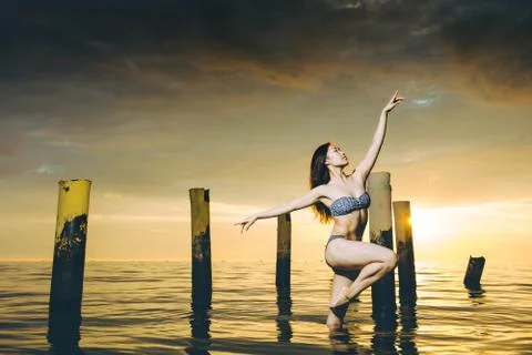 Dancer water sunset Stock Photos