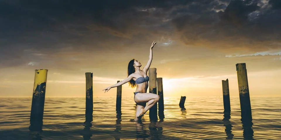 Dancer water sunset Stock Photos