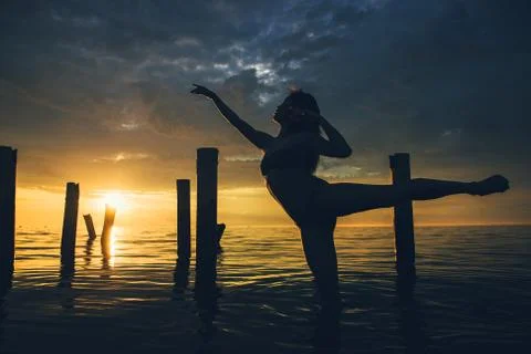 Dancer water sunset Stock Photos