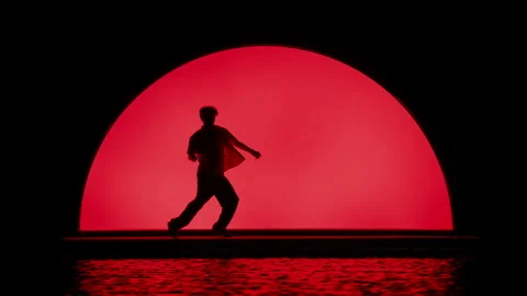 Dancer On The Waterfront Stage With Red Lighting Stock Footage 255537453