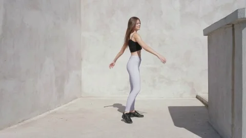 Dancer young woman outdoors spinning around. Slow motion Stock Footage