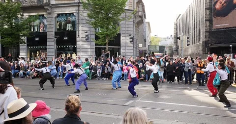 Dancers in 1950s attire doing a swing routine on Bahnhofstrasse on Sechseläuten Stock Footage 333838743