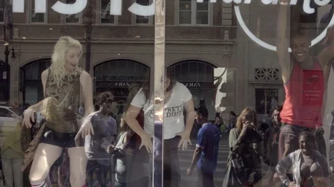 Dancers dancing in Hard Rock Cafe window display in Hollywood Los Angeles 4K LA Stock Footage