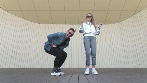 Dancers dancing street break dance on an open stage. Slow motion. Low shoot poin Stock Footage 132660404