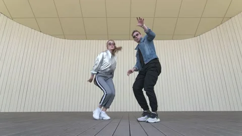 Dancers dancing street break dance on an open stage. Slow motion. Low shoot poin Stock Footage 132660411