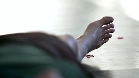 Dancers foot lying on the floor on the background of moving figure Stock Footage 150270731