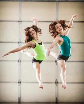 Dancers leaping in studio Stock Photos