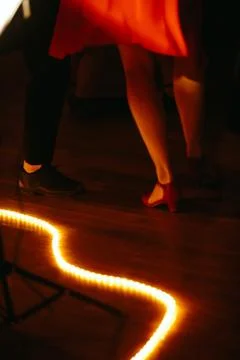 Dancers' legs with a red reflection Stock Photos