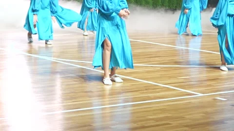 Dancers in Long Blue Dresses Performing Synchronized Choreography Stock Footage 337833533