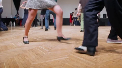 Dancers perform lindy hop dance at the swing festival. Dancing legs close up. Stock Footage