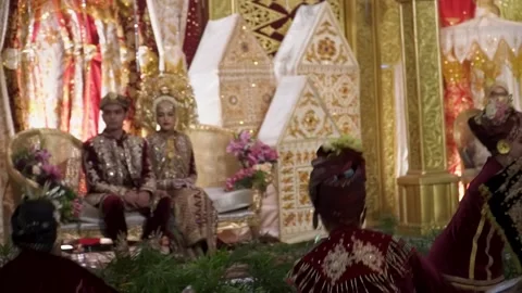 Dancers perform a Tari Piring "Plate Dance" fro Stock Footage 167883163