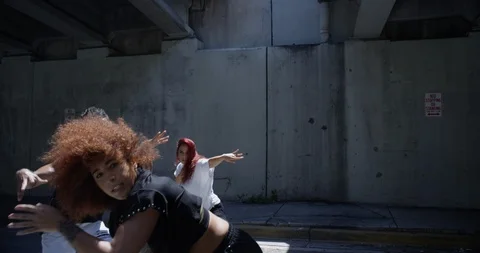 Dancers performing their routine under an overpass Stock Footage 97032361