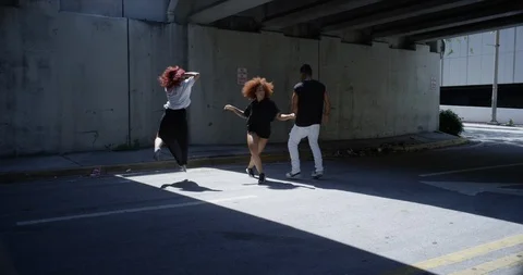 Dancers performing their routine under an overpass Stock Footage 97238360