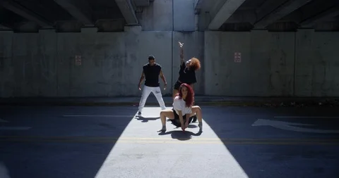 Dancers performing their routine under an overpass Stock Footage 97243474