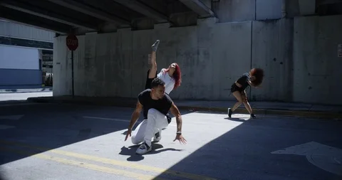 Dancers performing their routine under an overpass Stock Footage 97251521
